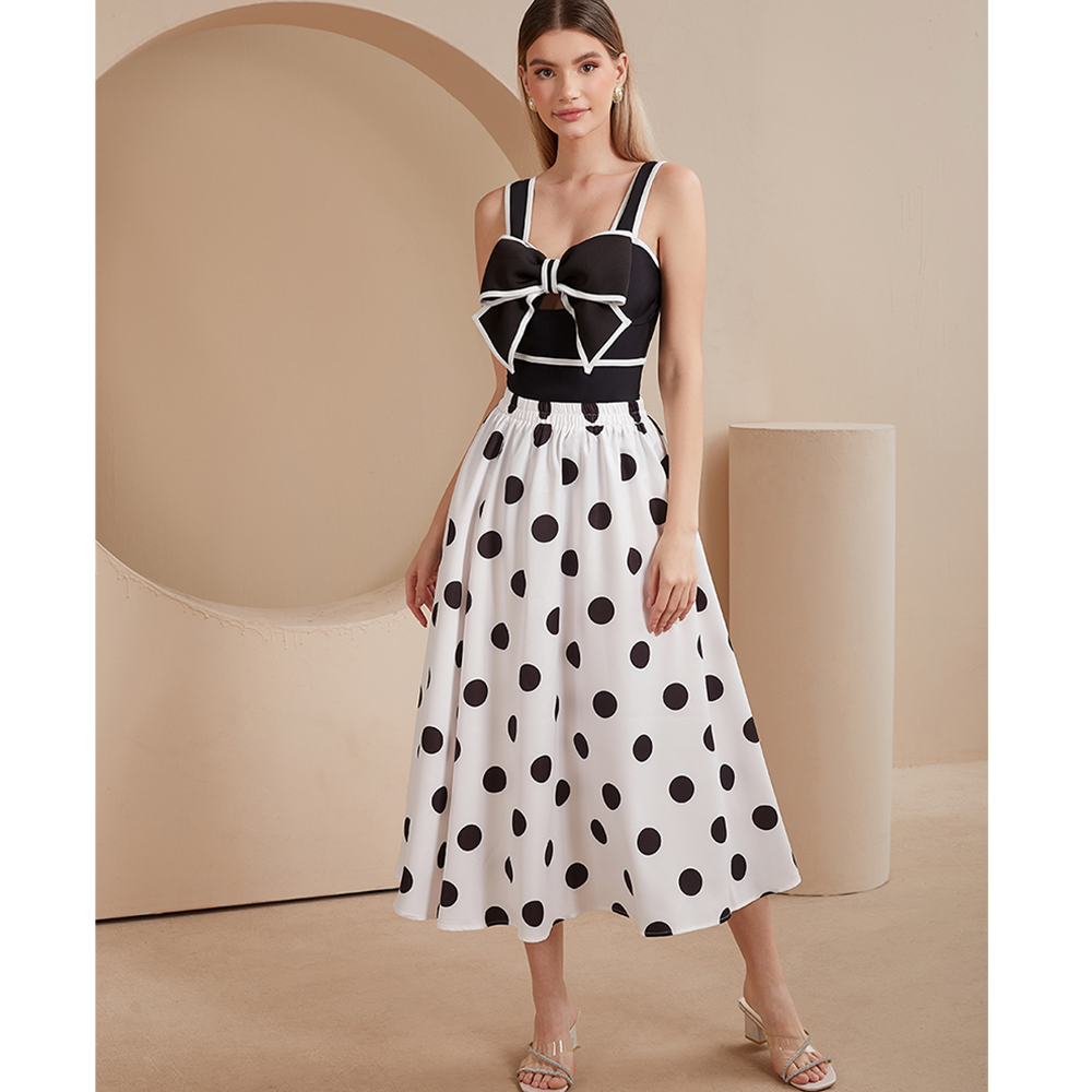 One-piece swimsuit and skirt with black and white bow decoration