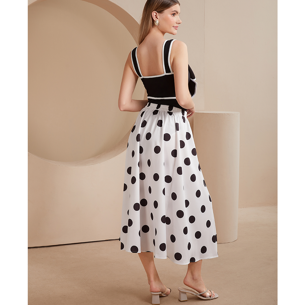 One-piece swimsuit and skirt with black and white bow decoration