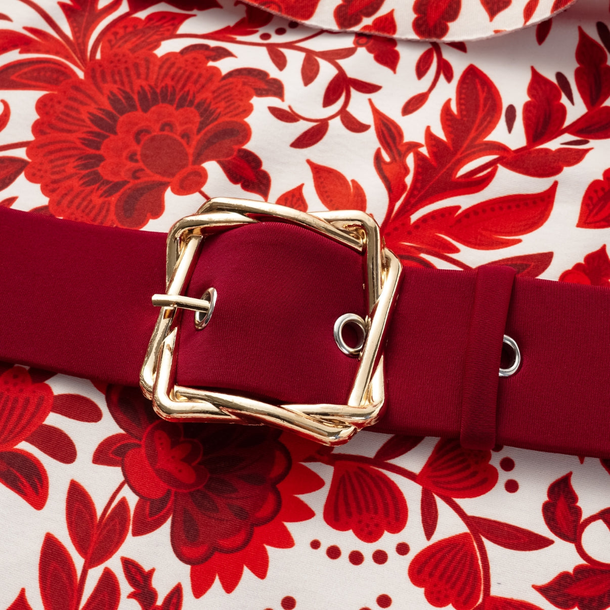 Red flower silhouette print one-piece swimsuit with ruffles and skirt