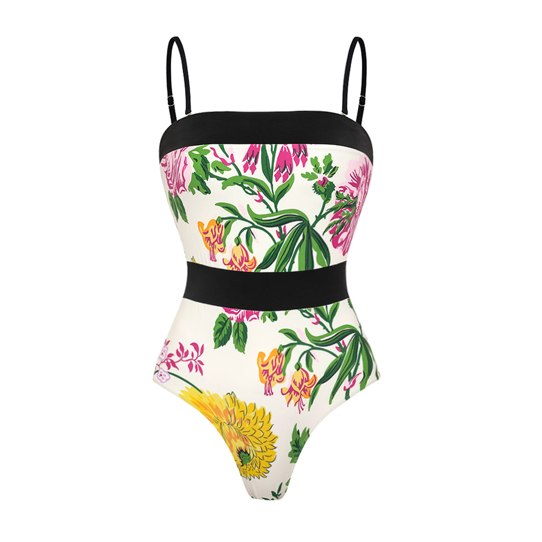 One-piece swimsuit with dropped shoulder straps, tie back, color block print and skirt