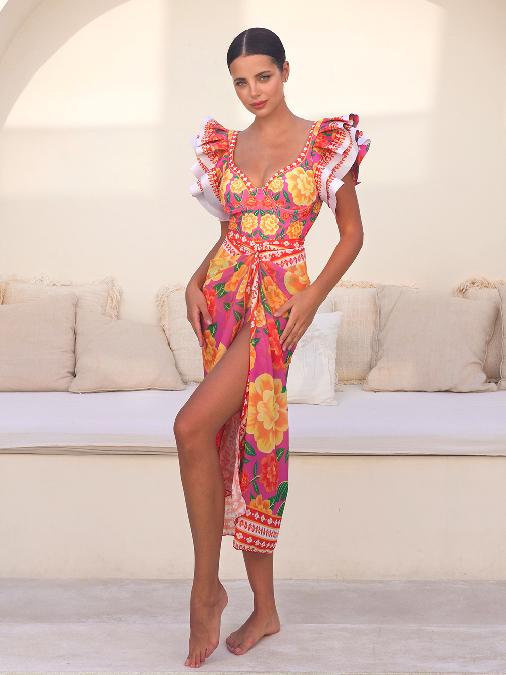 One-piece swimsuit with contrast print and ruffled sarong