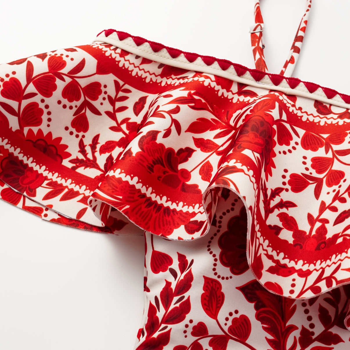 Red flower silhouette print one-piece swimsuit with ruffles and skirt