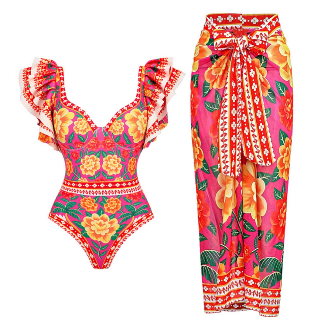 One-piece swimsuit with contrast print and ruffled sarong
