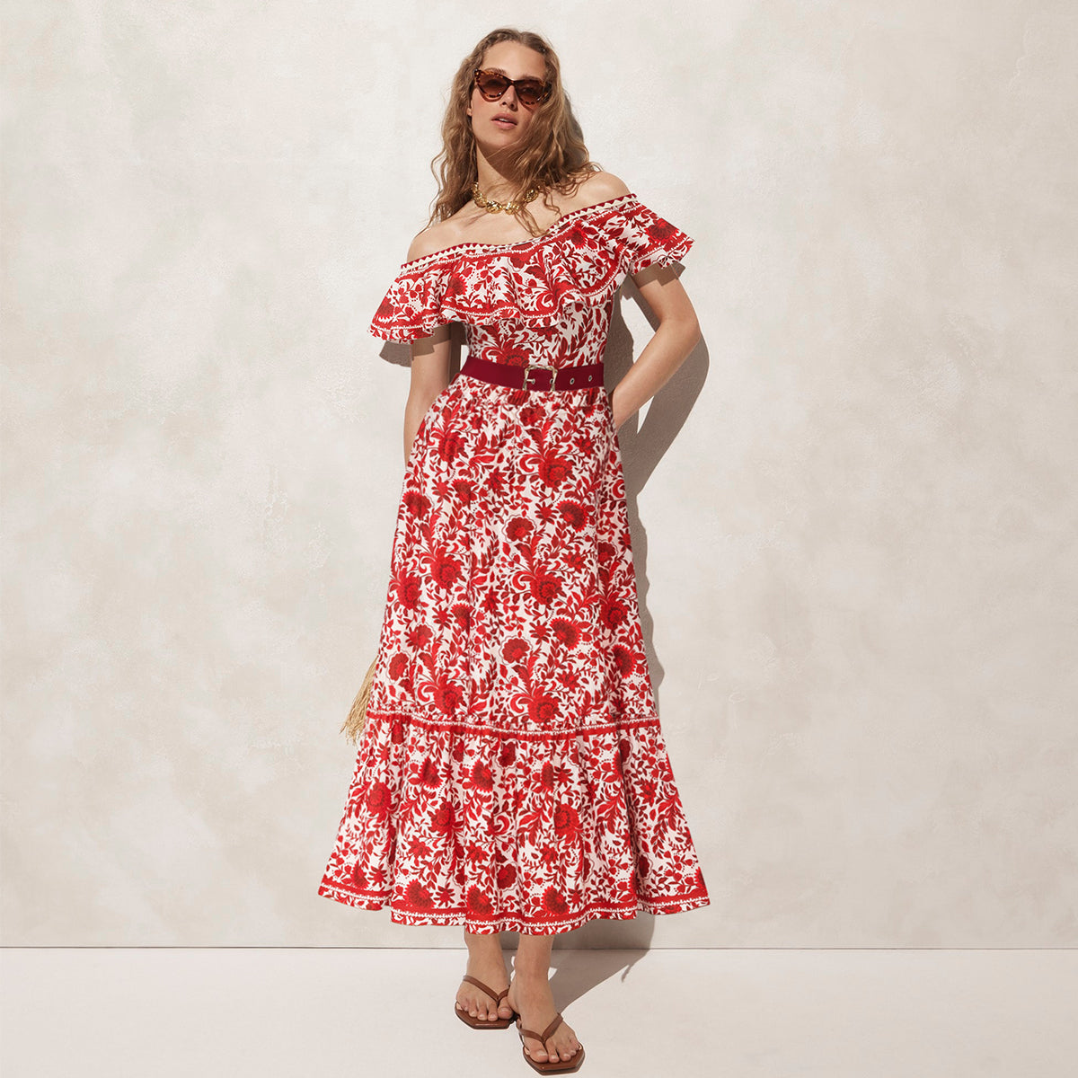 Red flower silhouette print one-piece swimsuit with ruffles and skirt