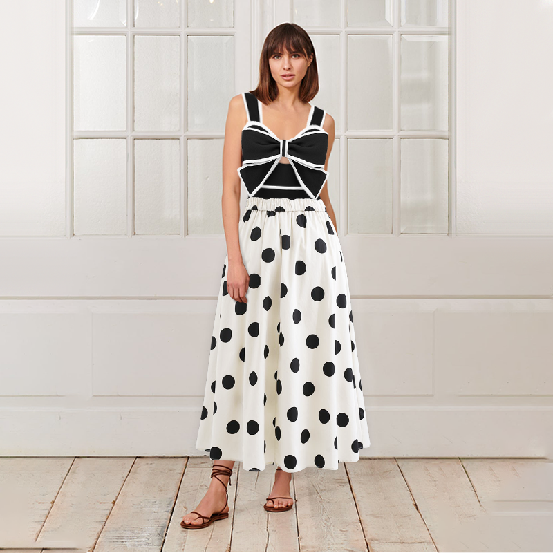 One-piece swimsuit and skirt with black and white bow decoration